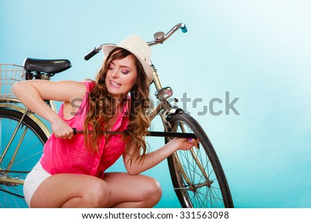 Similar – Image, Stock Photo Woman inflating bicycle tire in workshop