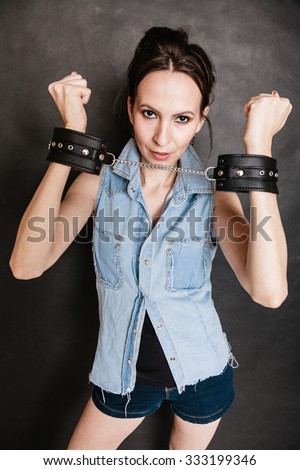 Arrest And Jail. Criminal Woman Prisoner Girl Showing Leather Handcuffs ...