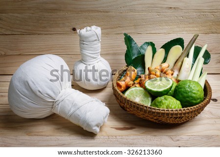 Spa herbal treatment on wood background