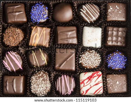 Box of chocolate truffles, close-up, from above - colorful selection of chocolate, chocolate gift