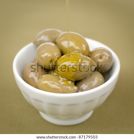 Healthy Olives and Olive Oil in a White Bowl