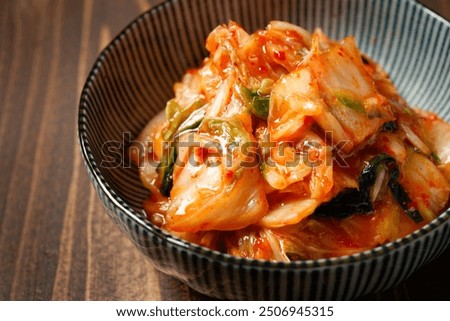 Similar – Image, Stock Photo Kimchi, fermented chinese cabbage in hot chili sauce , in bowl with chopsticks on rustic kitchen table. Close up