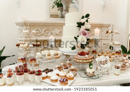 Similar – Image, Stock Photo Candy bar on wedding ceremony with a lot of different cupcakes, modern desserts, mousses and jellies. selective focus