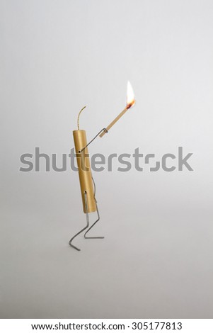 Bomb holding lighted stick