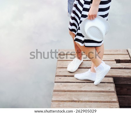couple kissing on the pier near lake in hot summer day, summer concept
