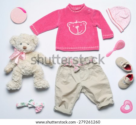 top view fashion trendy look of baby girl clothes and toy stuff, baby fashion concept