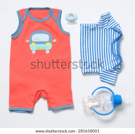 top view fashion trendy look of baby clothes and toy stuff, baby fashion concept