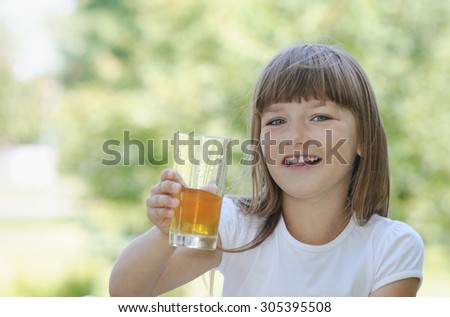 happy girl having fun on picnic in the park in sunny summer day, happy family concept