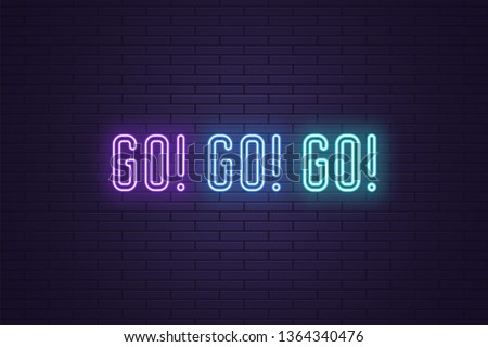 Neon Slogan of call to action GO. Vector illustration, glowing signboard of Motivational neon text GO GO GO. Colorful banner with Inspirational phrase on dark brick wall. Violet, blue and azure 商業照片 © 