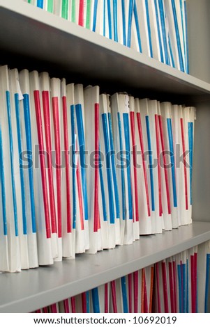 Shelf with folders for documents