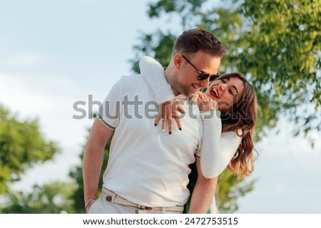 Similar – Image, Stock Photo Loving man and woman supporting each other while standing back to back