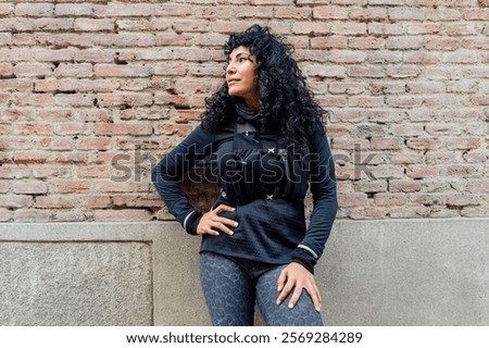 Similar – Image, Stock Photo Sportswoman leaning on wall on street and looking at camera