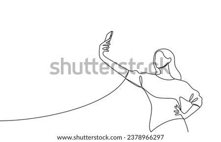 A woman with her hand on her hip takes a selfie or shoots a video through a mobile phone, smartphone. Vector illustration continuous line, line art, outline