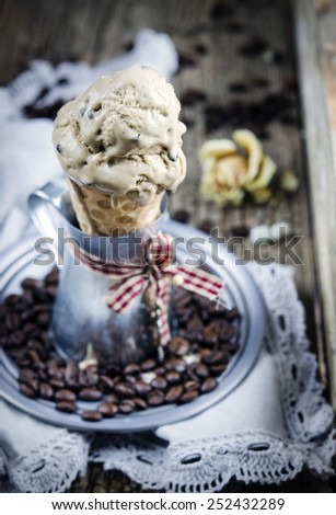 Coffee ice cream with chocolate drops in wafer roll