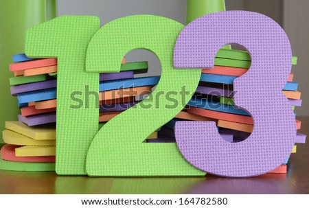 Colorful numbers 1, 2, 3, in a row of flat foam number toys