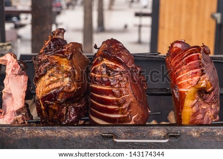 Roasted pig on the spit for a big party