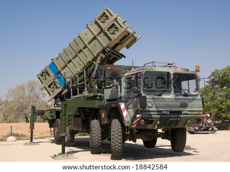 Anti-aircraft guided, ground-air missile system on heavy vehicle.