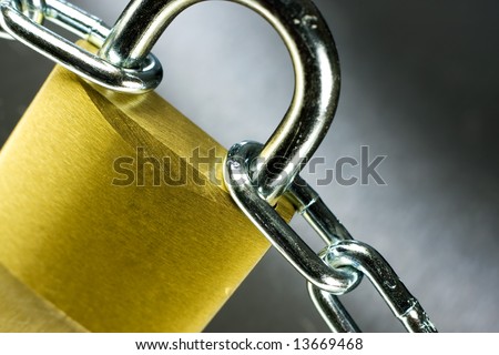 Strong Security Lock & Chain on a metal background
