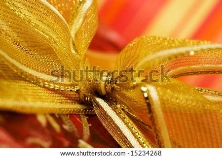 Closeup of red box with golden ribbon