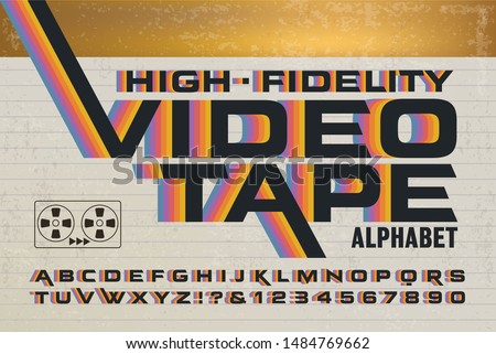 A retro alphabet with 1980s style rainbow effects. High-fidelity videotape packaging font with colorful stripes on a video cassette box.