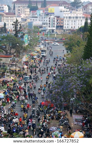 DA LAT, VIET NAM, AISA- FEB 8: Crowded, busy scene 's market with crowd of people go to markets to buy goods repair for Tet in DaLat, VietNam, Asia on February 8, 2013