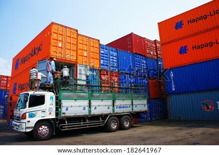 HO CHI MINH CITY, VIET NAM- MAR 19 :  Truck load cargo from container at freight depot, cargo box in stack, this industrial port is logistic service of import, export  goods ,Vietnam, Mar 19, 2014