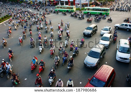 HO CHI MINH CITY, VIET NAM- APRIL 4: Circulation by private vehicle at Asia city, people transport by motorbike coming home in a row, crowded atmosphere after working day, Vietnam, April 18, 2014