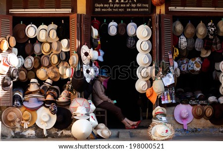 HOI AN, VIETNAM- MAY 15: Abstract hat shop show many kind of hat at front of ancient wooden house of antique market, Hoian is famous place for travel, Viet Nam, May 15, 2012