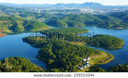 Fantastic landscape of eco lake for travel at Dalat, Viet Nam, fresh atmosphere, villa among forest, impression shape of hill and mountain from high view, wonderful vacation for ecotourism in spring