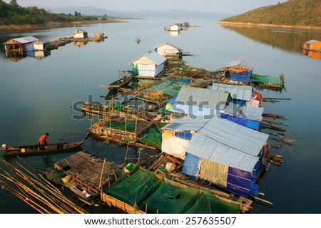 DAKLAK, VIET NAM- FEB 26: Asian residence on water,  group of floating house of fishing village, beautiful Vietnamese countryside, impression panoramic, Dak Lak, Vietnam, Feb 26, 2015