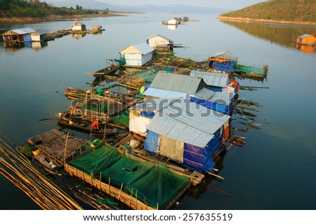 DAKLAK, VIET NAM- FEB 26: Asian residence on water,  group of floating house of fishing village, beautiful Vietnamese countryside, impression panoramic, Dak Lak, Vietnam, Feb 26, 2015