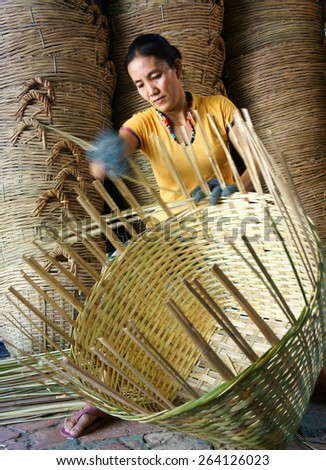 VINH LONG, VIET NAM- MAR 24: Asia trade village at Mekong Delta, Vietnamese people work inside to make basket from bamboo material, clever hand and hard working to make product, Vietnam, Mar 24, 2015