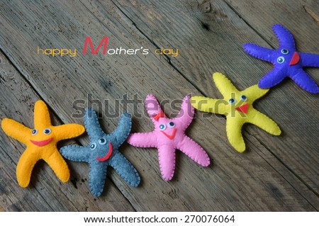 Happy mothers day with i love you mom message,  idea from colorful fiber starfish on wooden background, abstract wooden texture, mother\'s day is special day for mom,