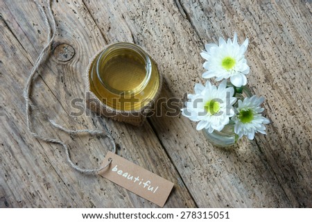 Coconut oil, essential oil from nature, a skin care that safe, rich vitamin, use in massage at spa, organic cosmetic on wooden background