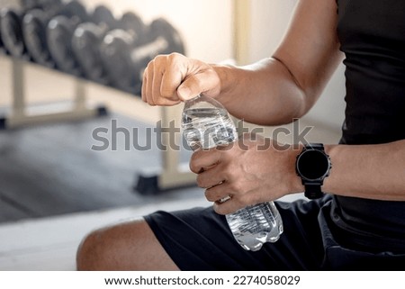 Similar – Image, Stock Photo Black athletic man sitting on lawn and using smartphone