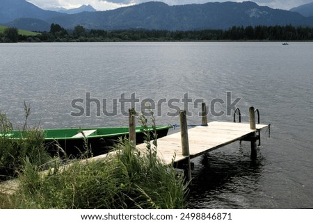 Similar – Foto Bild Bootssteg oder Badesteg aus schönem alten Holz im Sommer bei Sonnenschein am Alpsee in Schwangau bei Füssen im Allgäu im Freistaat Bayern