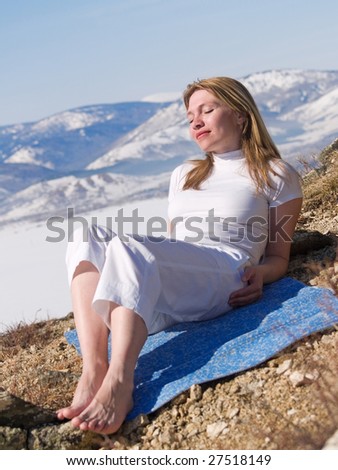 woman reposes in cool air