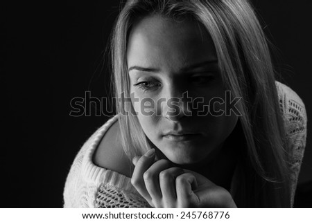 Crying girl. dark tones. Black and white