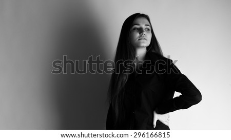 Black and white portrait of a girl on a white background