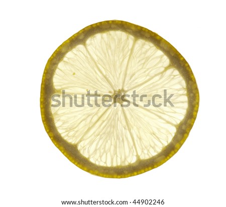 Cross section slice of back lit lemon, isolated on white background.