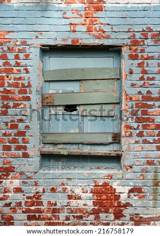 Old window and bricks wall. Old window and wall with shabby paint of thrown house.