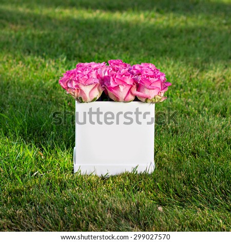 Bouquet of pink roses in a box