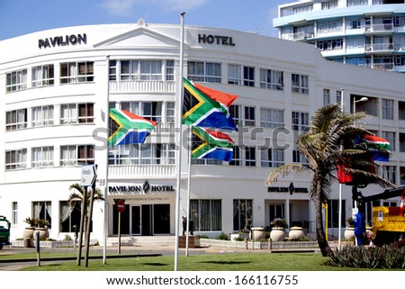 DURBAN, SOUTH AFRICA - DECEMBER 6, 2013: South African flags flying at half-mast in honor of Nelson Mandela in Durban, South Africa, December 6, 2013.