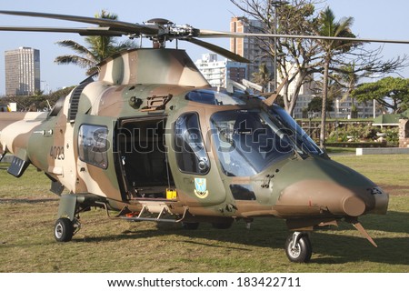 DURBAN, SOUTH AFRICA - MARCH 22, 2014: South African Military helicopter lands on beach front in Durban South Africa.