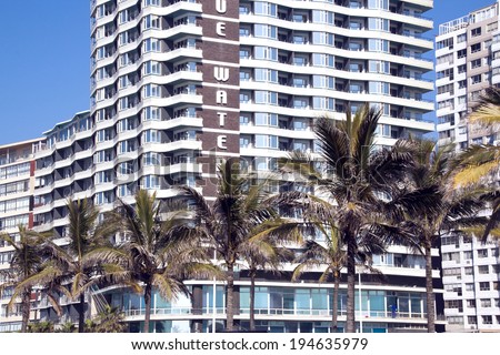 DURBAN, SOUTH AFRICA - May 24, 2014: Closeup of palm trees and residential complexes on Golden Mile Beachfront in Durban South Africa