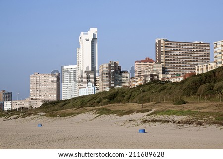 DURBAN, SOUTH AFRICA - JULY 23, 2014: View of empty beach and residential buildings on Golden Mile beach front in Durban, South Africa