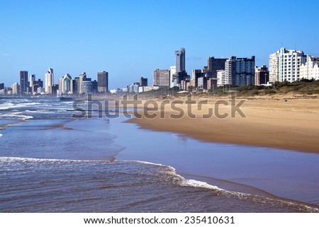 DURBAN; SOUTH AFRICA - DECEMBER 4; 2014 : Early morning people on beach against \