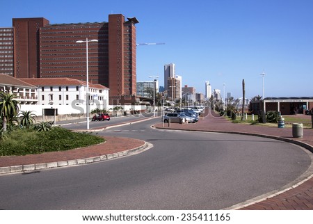 DURBAN; SOUTH AFRICA - DECEMBER 4; 2014 : Many unknown people amongst commercial and residential buildings along the \