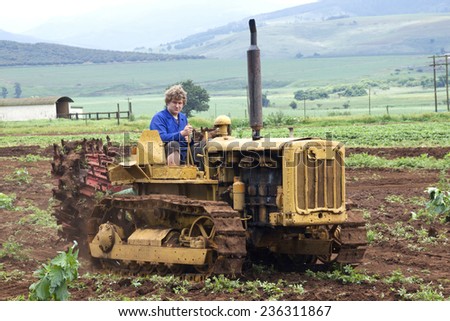 Richmond, KwaZulu Natal, South Africa - December 7, 2014: Unknown man on Vintage Caterpillar Diesel Forty at Natal Vintage Tractor and Machinery Club at Baynesfield Estate in Richmond, KwaZulu-Natal
