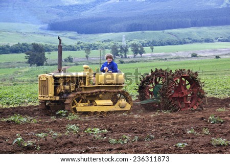 Richmond, KwaZulu Natal, South Africa - December 7, 2014: Unknown man demonstrating Vintage Caterpillar Diesel Forty at Natal Vintage Tractor and Machinery Club at Baynesfield Estate in Richmond,